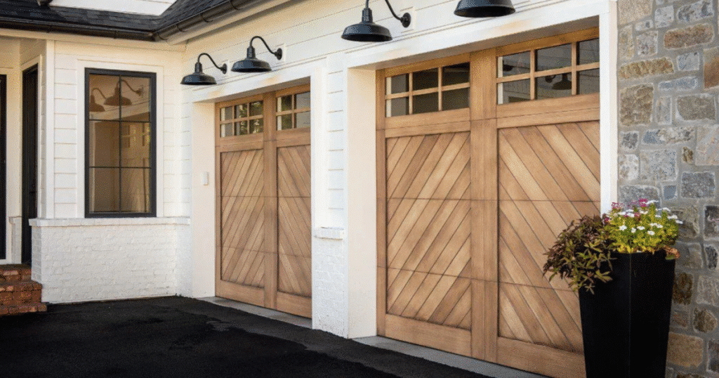 Chevron wood garage doors with upper windows.
